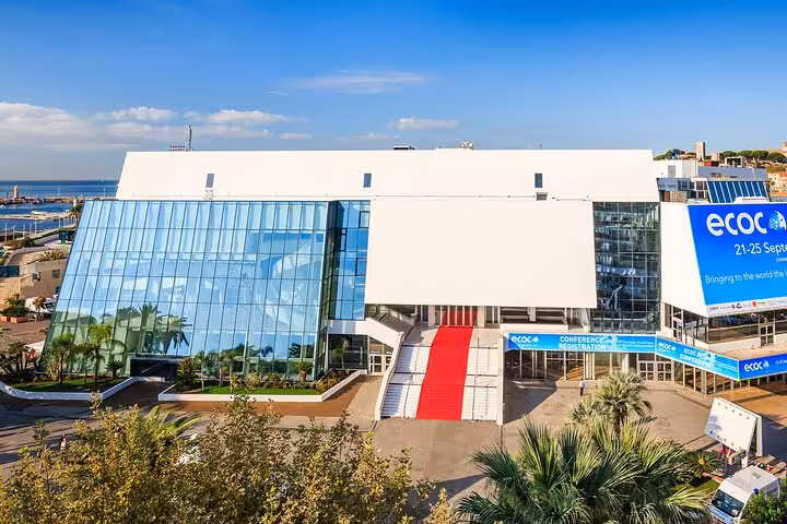 Aerial view of Palais des Festivals in Cannes with red carpet entrance and ECOC conference banners