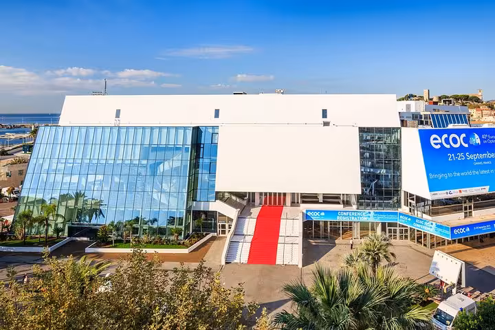 Palais des Festivals et des Congrès in Cannes with red carpet entrance and ECOC conference banners