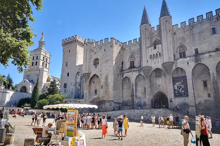 Palais des Papes in Avignon with crowds, highlight of full-day shore excursion to Avignon and Aix-en-Provence