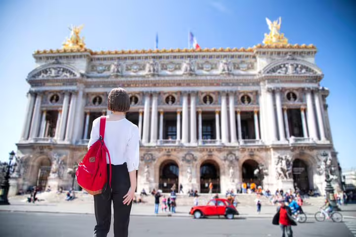 Traveler exploring the stunning architecture of Palais Garnier in Paris, highlighting hidden gems and undiscovered quarters.