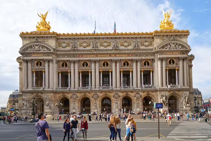 The image shows the majestic Palais Garnier in Paris, showcasing its ornate architecture, a highlight of the private Paris tour.