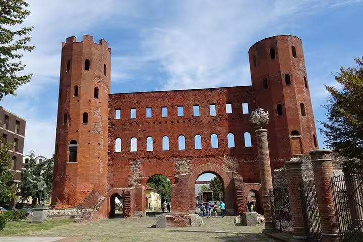 Ancient Roman Palatine Gate brick towers and arched entrance in Turin, Italy