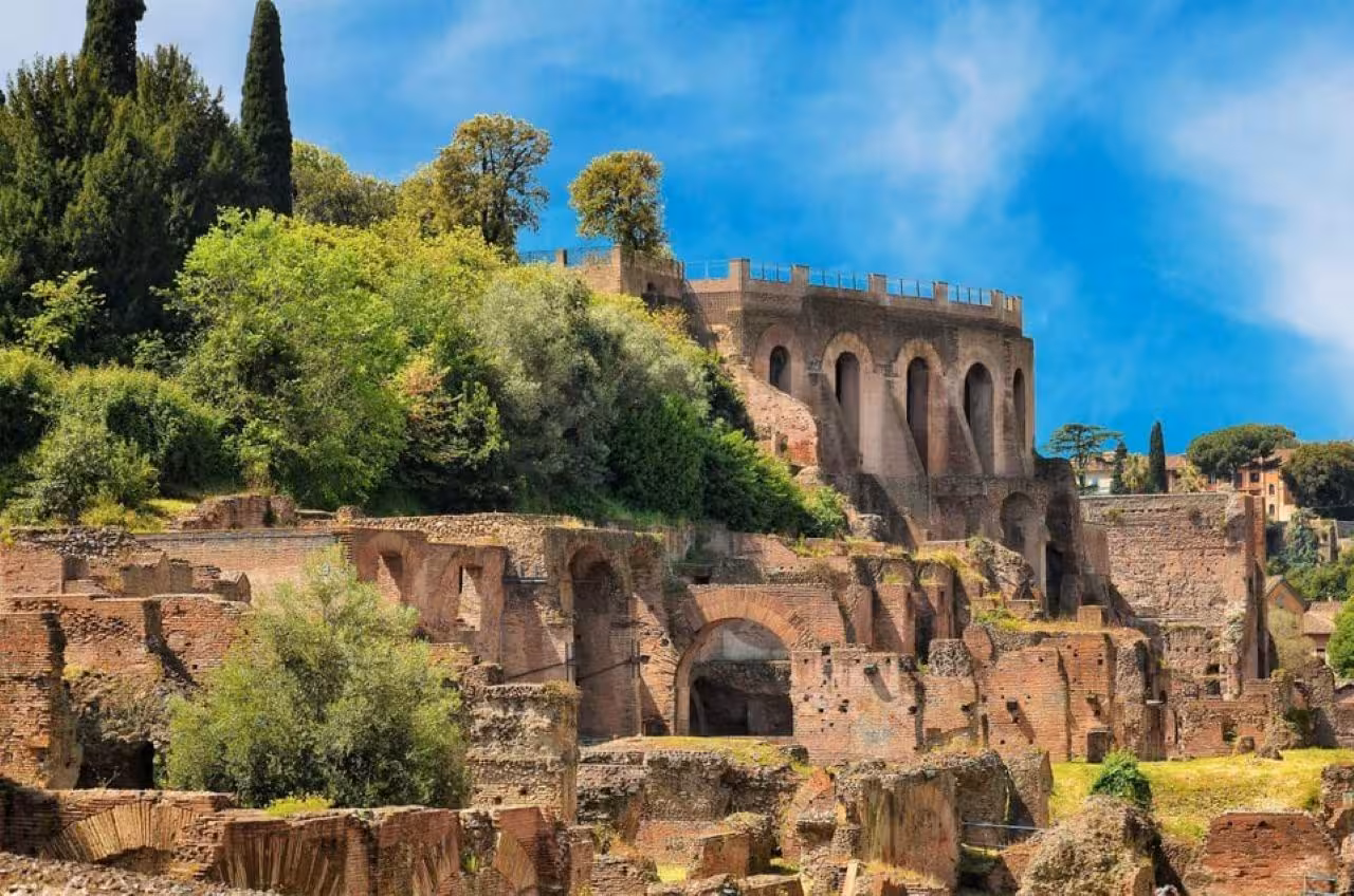 Explore the ancient ruins of Palatine Hill in Rome, surrounded by lush greenery and historical architecture.