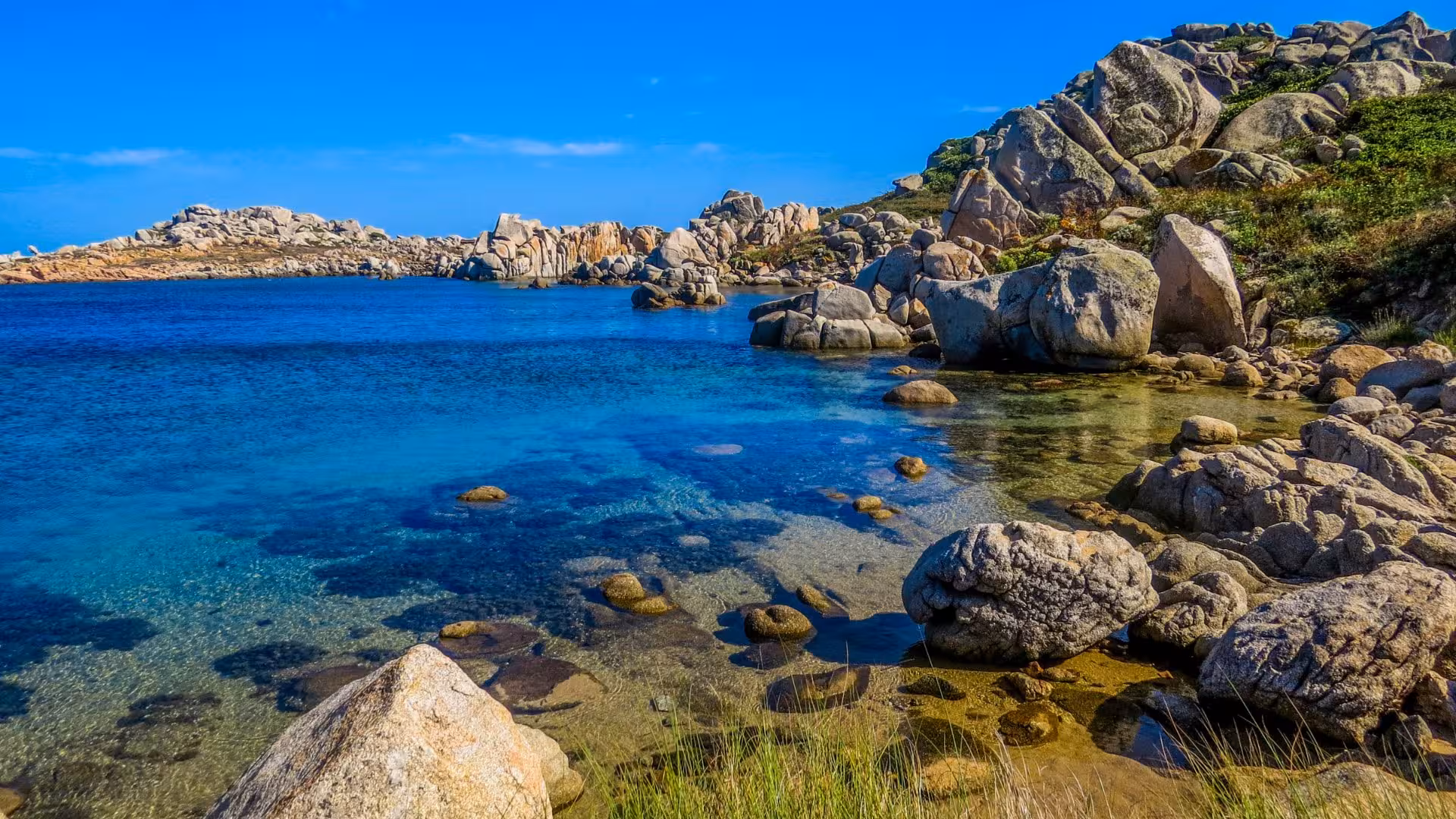 Pristine blue waters and rocky coastline of Palau, perfect for exploring on a Corsica boat tour.