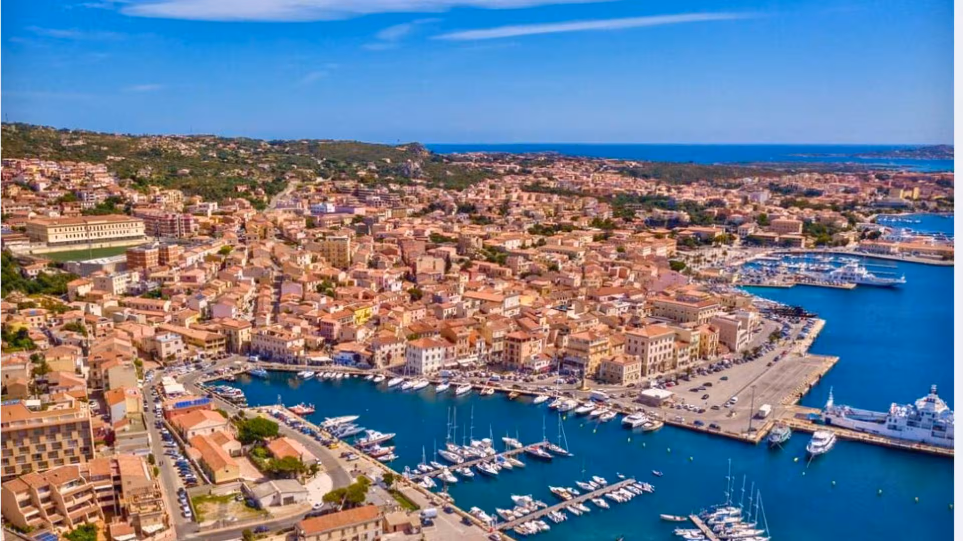 Aerial view of Palau's charming harbor and vibrant town, perfect for exploring Sardinia's rich history and culture.