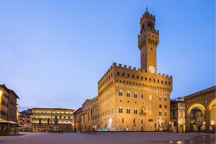 Palazzo Vecchio illuminated at dusk in Piazza della Signoria, Florence, Italy