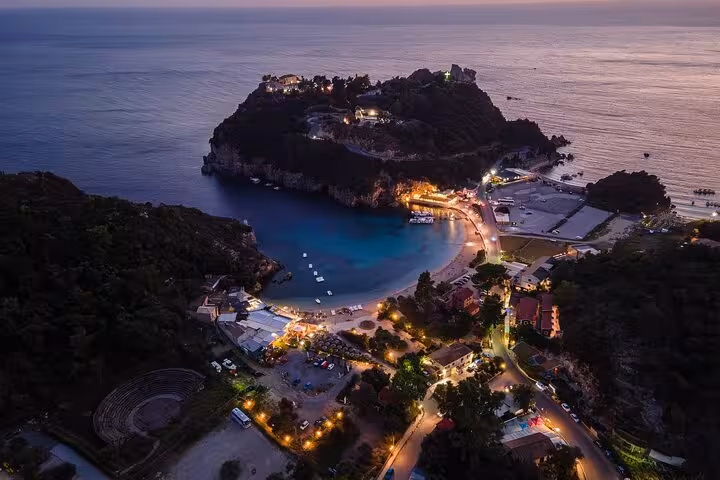 Aerial view of Paleokastritsa bay at dusk, Corfu, on a private tour with scenic coastal stops and tastings