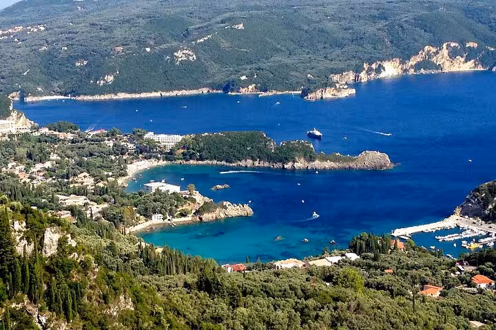 Panoramic view of Paleokastritsa bay, Corfu cliffs and deep blue sea on a private sightseeing tour with tastings