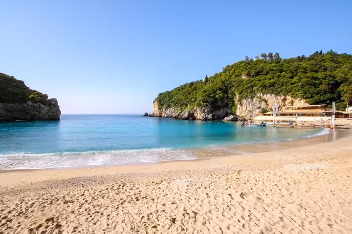 Paleokastritsa beach in Corfu with turquoise sea and cliffs, scenic stop on a private full-day tour
