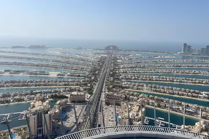 Panoramic view of Palm Jumeirah fronds from The View at The Palm, Dubai, with Atlantis on the horizon