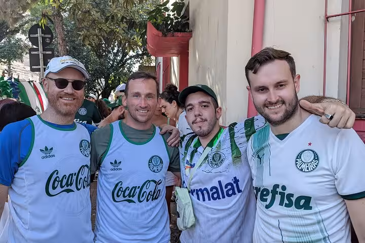 Travelers with local host wearing Palmeiras jerseys before match in São Paulo, Palmeiras game experience tour