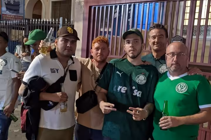 Palmeiras supporters pose with beers before match in São Paulo on Palmeiras Game Experience with Local host