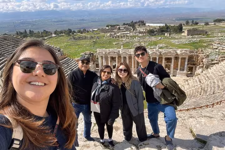 Group selfie overlooking Hierapolis theater ruins, private Pamukkale day trip from Kusadasi or Selcuk