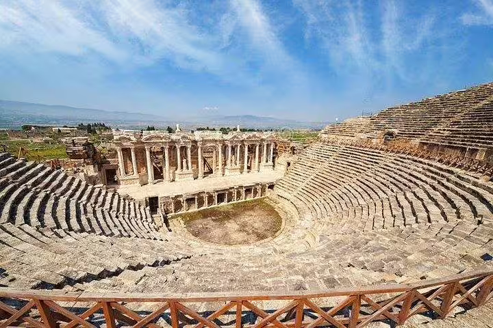 Explore the ancient Roman amphitheater in Pamukkale on a private tour from Kusadasi Port, showcasing its grandeur.
