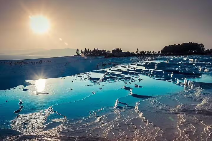Breathtaking view of Pamukkale's travertine terraces reflecting sunlight, a highlight of the day tour from Istanbul.
