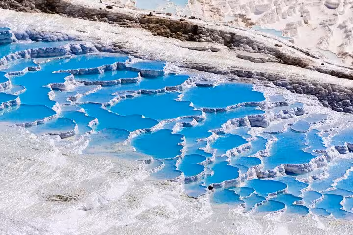 Iconic Pamukkale turquoise travertine terraces and white calcium pools on an all-inclusive private guided tour