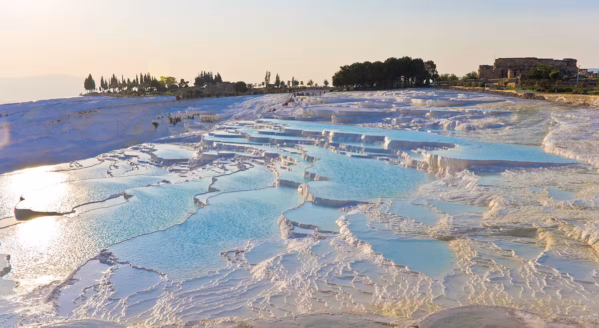 Pamukkale white terraces with shallow blue water