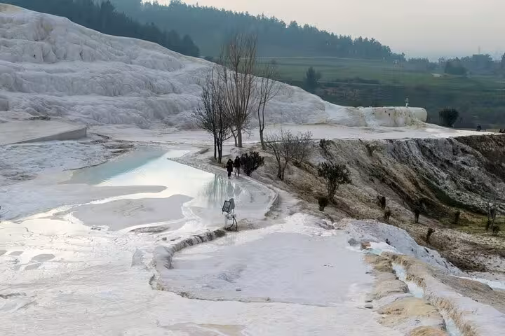Pamukkale white travertine terraces and thermal pools on a private day tour from Denizli Airport
