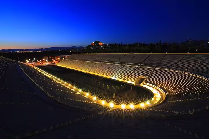 Panathenaic Stadium lit up at night in Athens, Greece, scenic stop on an evening highlights city tour