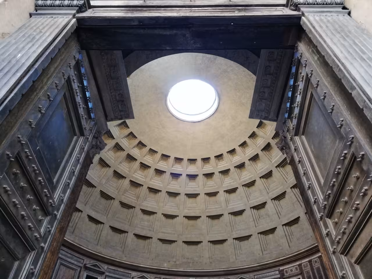 Pantheon interior dome and oculus in Rome, dramatic architecture featured on Baroque Rome extravagance tour