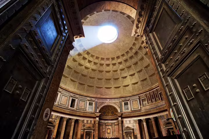 Interior dome of the Pantheon in Rome with light streaming through the oculus
