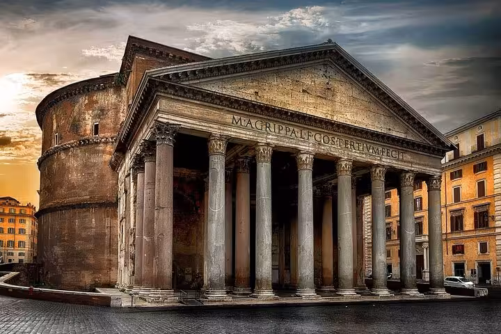 Dramatic sunset over the Pantheon in Rome, highlighting the historic architecture for skip-the-line tours with audio guide.
