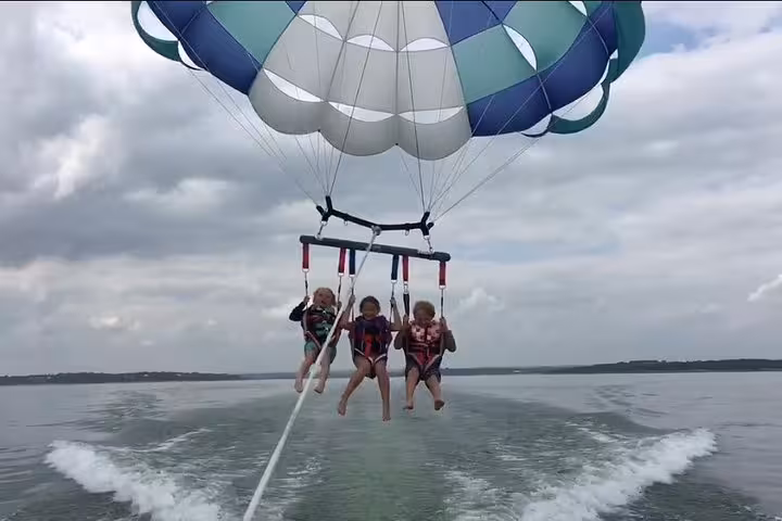 Triple parasailing ride behind speedboat in Hurghada, gliding over Red Sea near El Gouna, Makadi and Soma Bay