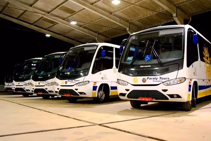 Fleet of Paraty Tours buses ready for shared transfer from Paraty to Angra Dos Reis, offering comfort and reliability.