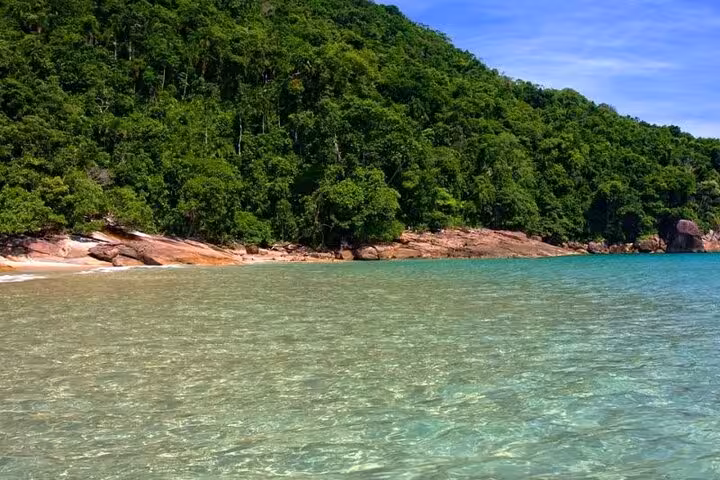 Discover the untouched beauty of Paraty's pristine beaches and vibrant greenery on an exclusive boat tour.