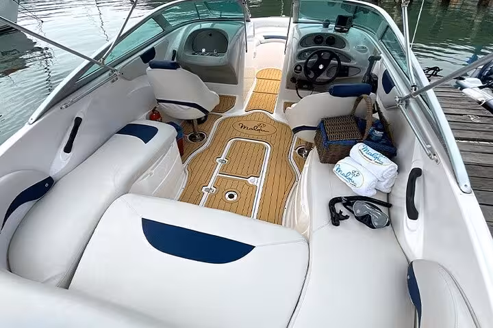 Luxurious boat interior featuring cushioned seating and amenities for a premium Paraty exclusive boat tour adventure.