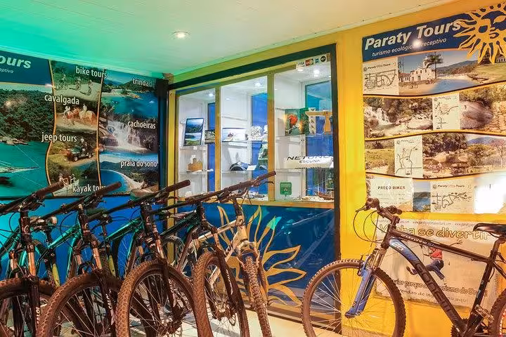Paraty Tours bike rental shop featuring a variety of bicycles for scenic eco-tours and outdoor exploration.