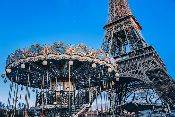 Paris carousel beside the Eiffel Tower, perfect for a private luxury lunch tour with Seine cruise and Louvre