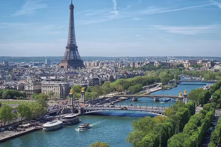 Aerial view of Paris with Eiffel Tower and Seine River bridges on a sunny day