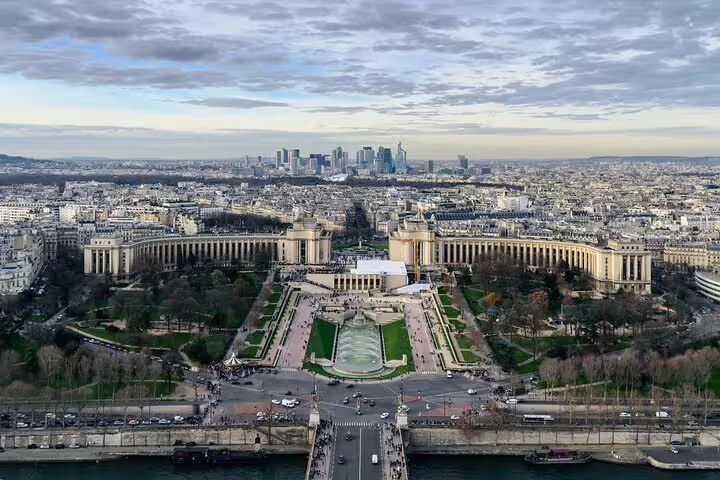 Aerial view of Trocadero gardens and Palais de Chaillot from Eiffel Tower, Paris skyline with La Défense in background