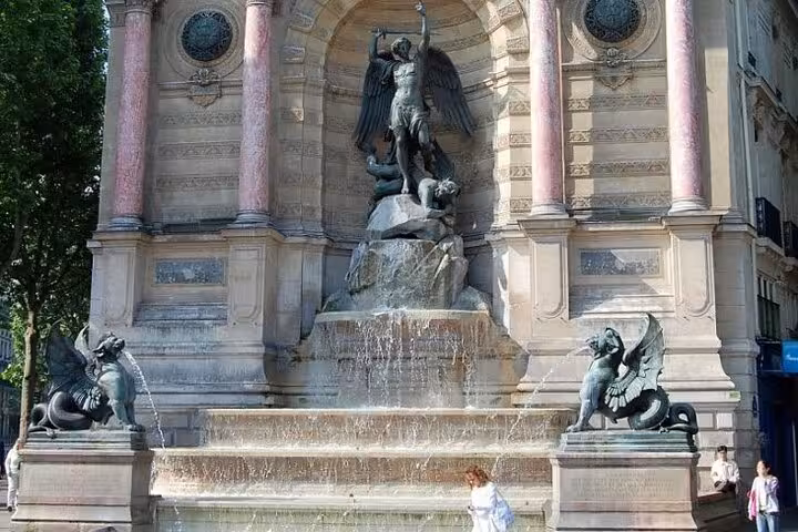 Fontaine Saint-Michel fountain with bronze angel statue and dragon sculptures in Paris