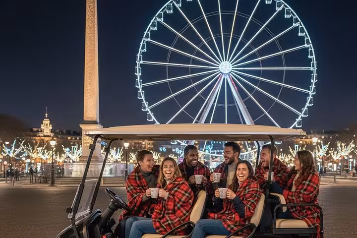 Group of friends wrapped in plaid blankets on a golf cart tour at Place de la Concorde with lit Ferris wheel at night