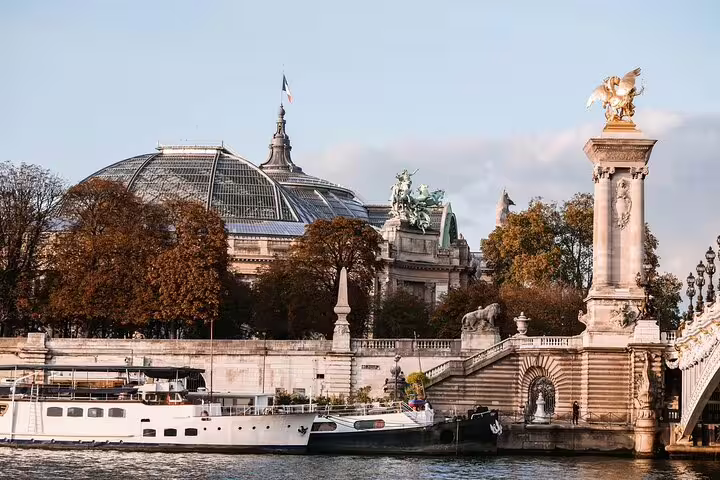 Grand Palais dome and Pont Alexandre III bridge over the Seine River in Paris