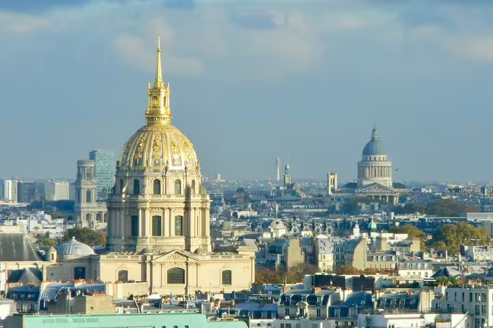 Golden dome of Les Invalides with the Panthéon and Paris skyline in the background