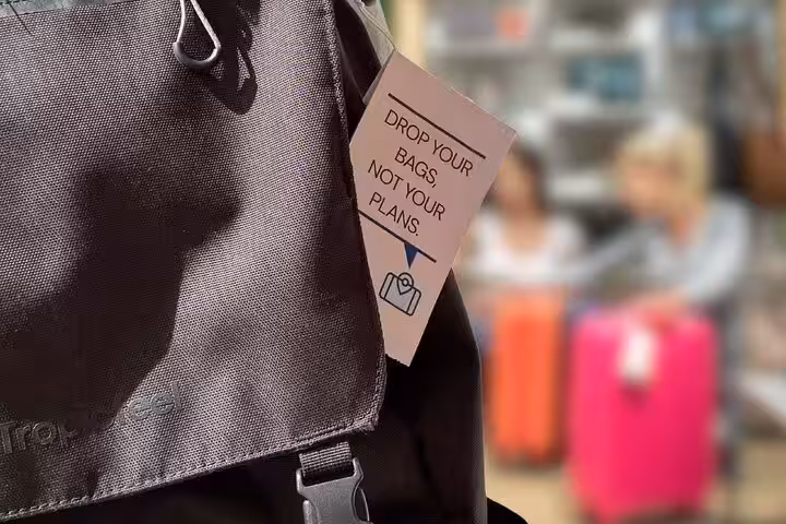Close-up of travel bag tag promoting secure luggage storage near the Eiffel Tower in Paris for tourists