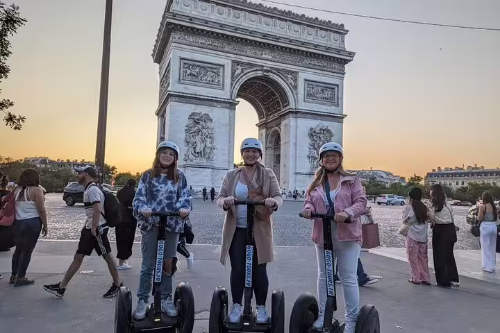 Segway group at Arc de Triomphe at sunset, Paris by Night tour with local guide and helmets