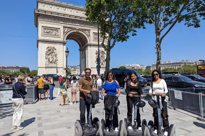 Segway group tour at the Arc de Triomphe in Paris, part of a Seine River cruise ticket package