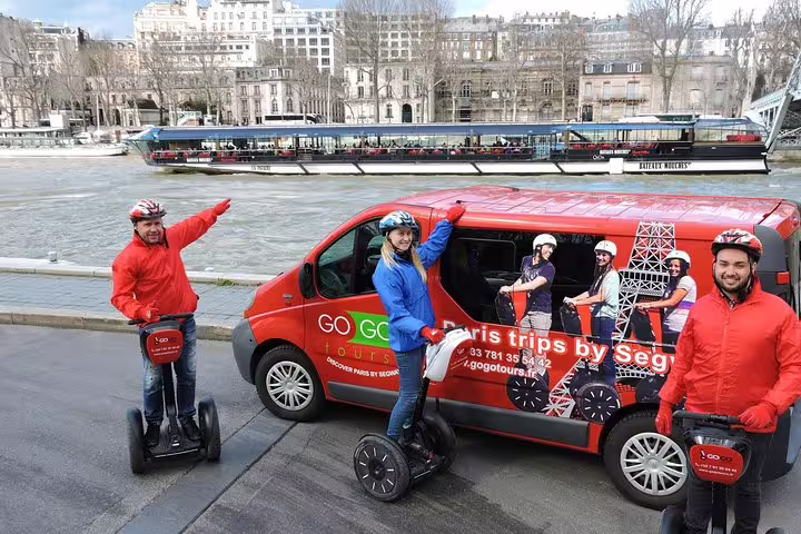 Paris Segway tour riders by the Seine with cruise boat behind, ideal combo tour with Seine River cruise ticket