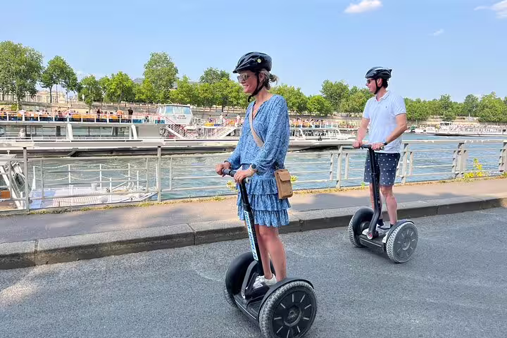 Riding Segways along the Seine riverbank in Paris, city highlights tour with included Seine cruise ticket
