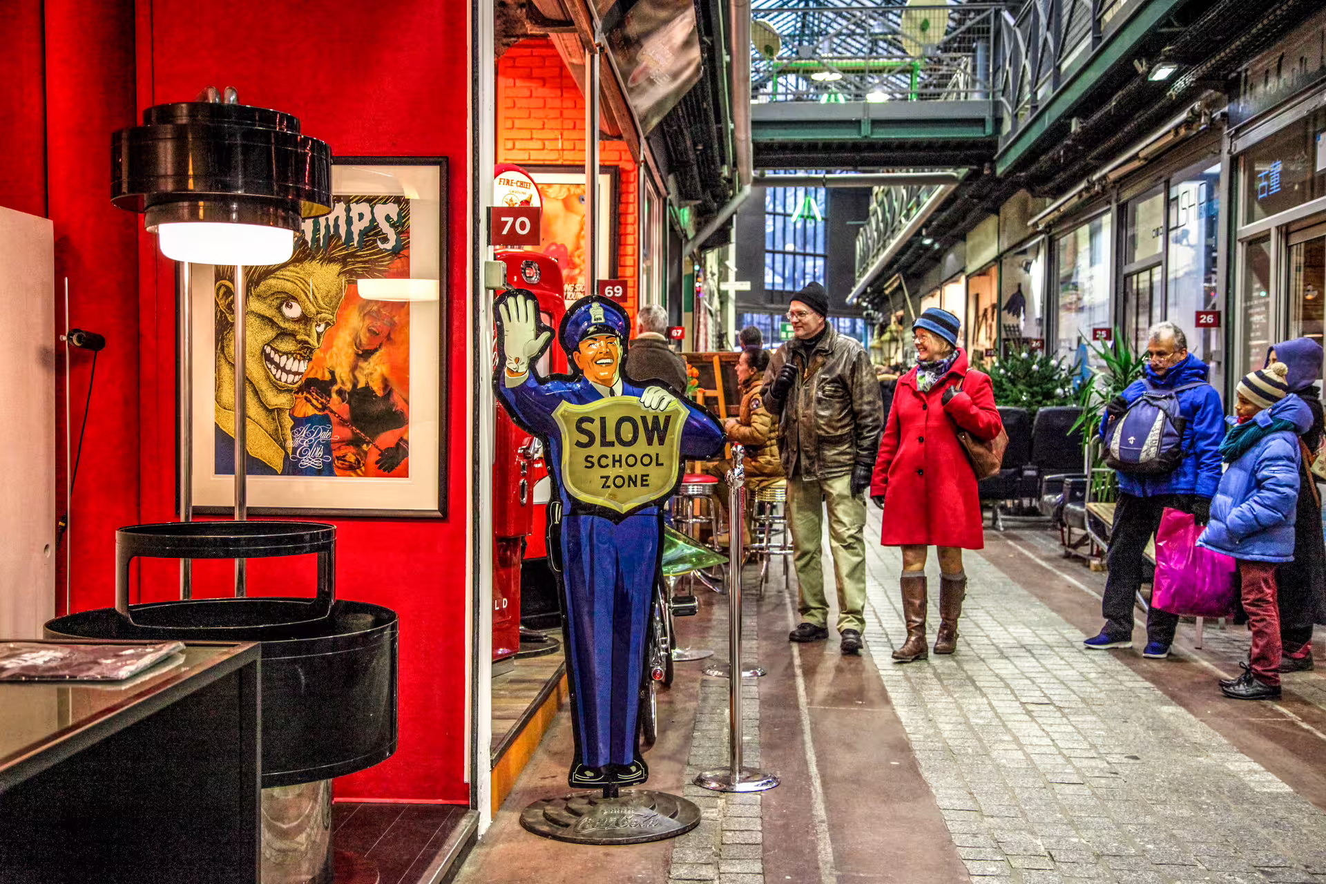 Vintage police slow school zone figurine at Paris St. Ouen antique flea market indoor gallery