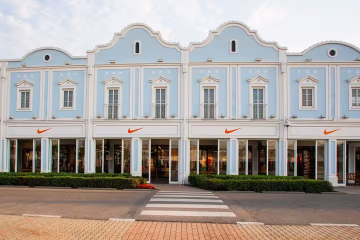 Parndorf Designer Outlet storefronts in Austria, shopping stop during Budapest to Vienna private transfer service