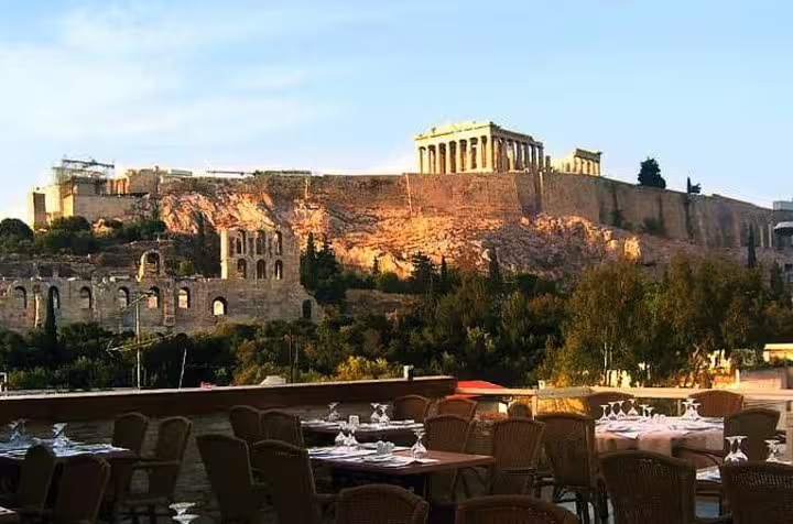 Parthenon atop Acropolis viewed from Athens rooftop taverna during Viator Greek dinner tour