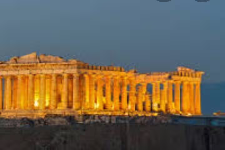The Parthenon on the Acropolis illuminated at night during a private Athens city tour