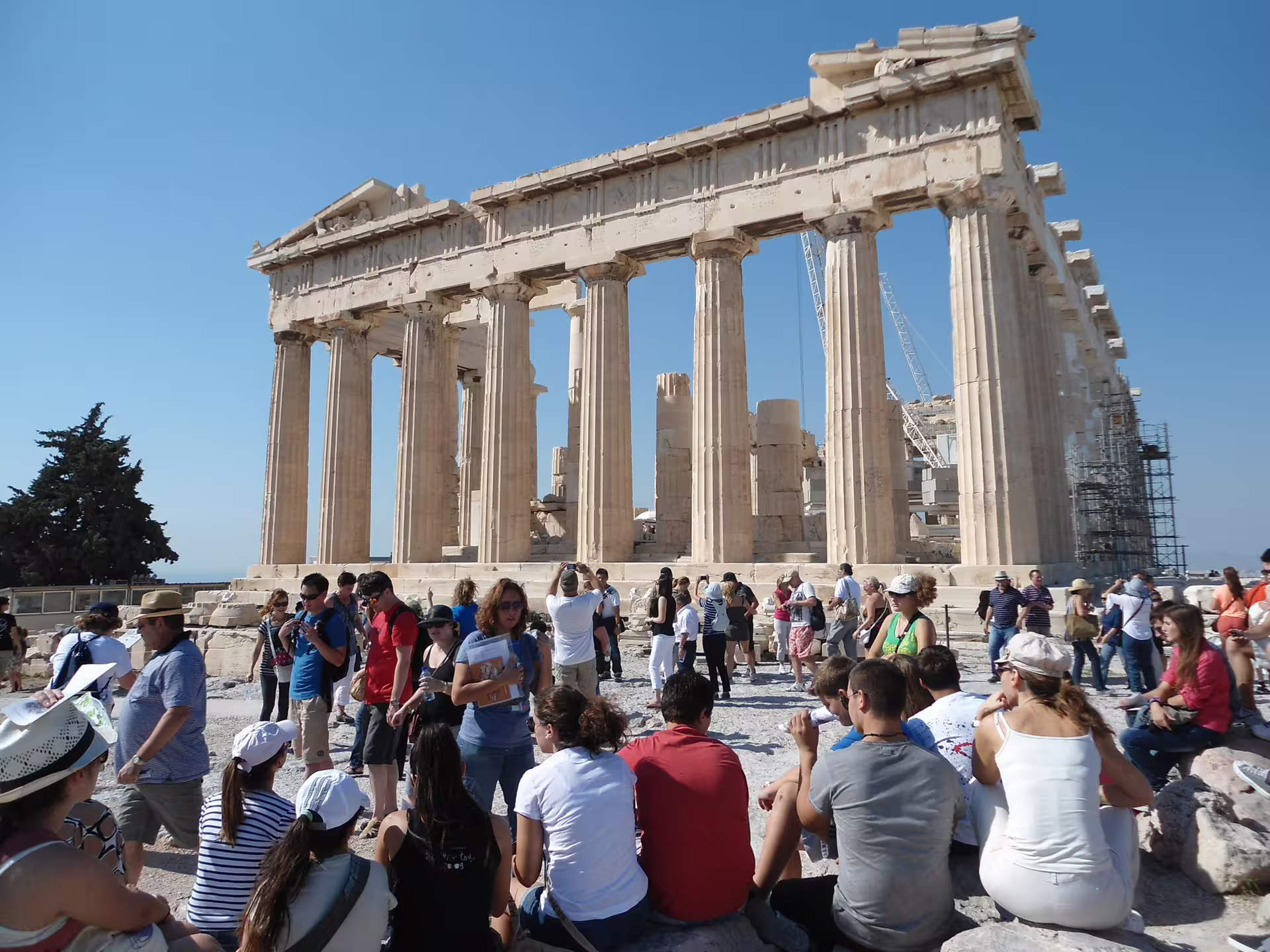 Parthenon columns on the Acropolis with visitors, Athens private guided tour of monuments and city center