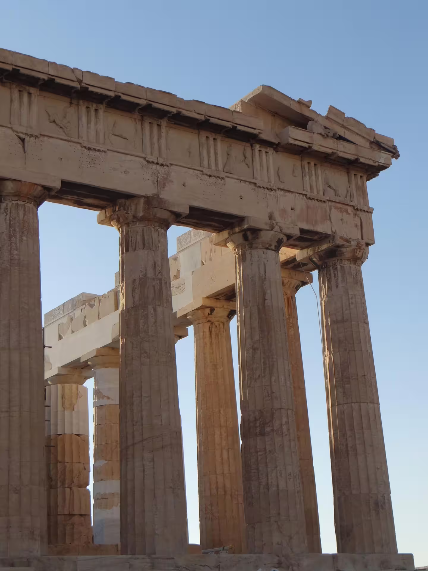 Parthenon Doric columns close-up on Acropolis of Athens, skip-the-line guided walking tour under blue sky