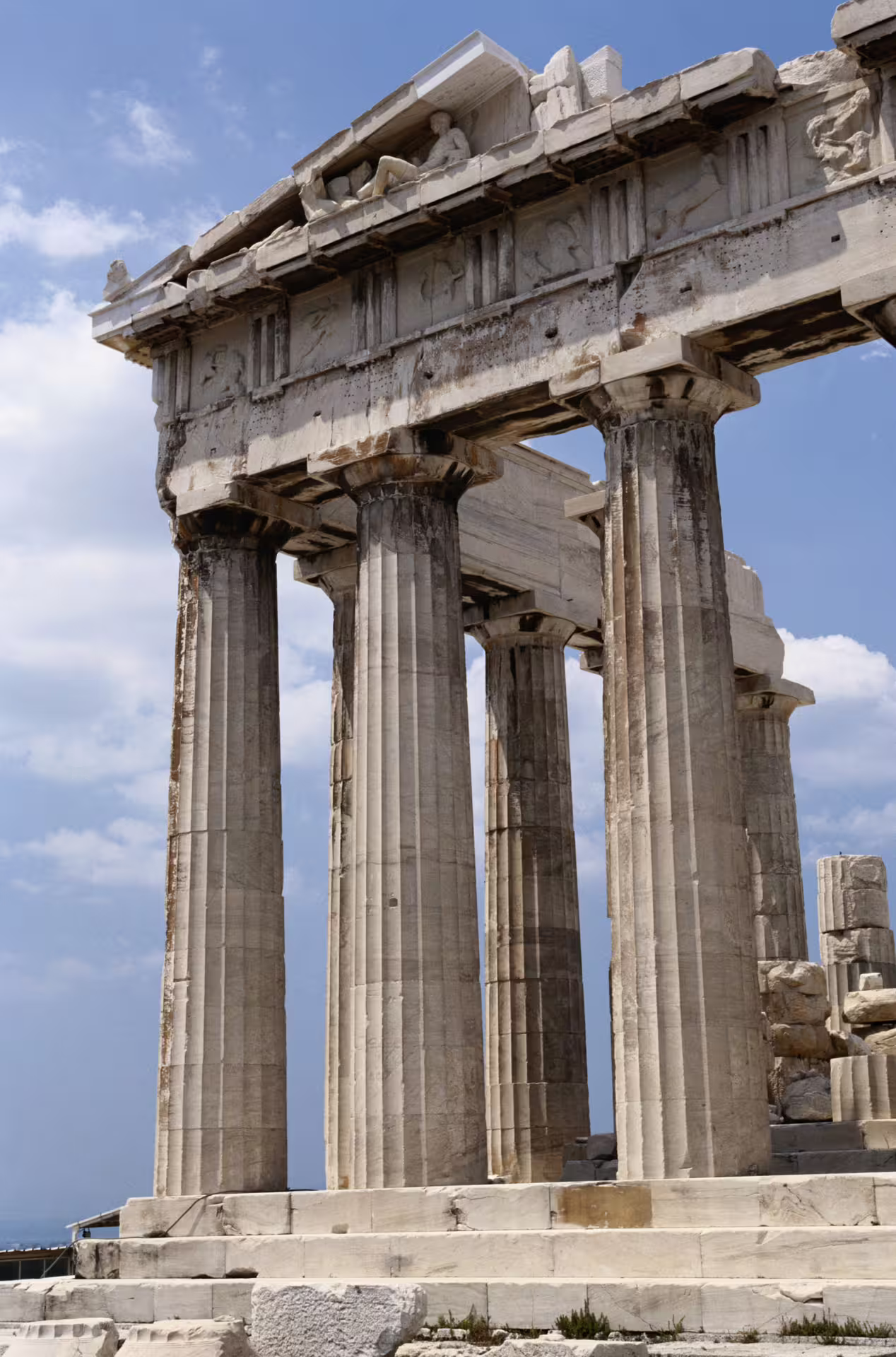 Close-up of Parthenon Doric columns and sculpted pediment, highlight of a private Classical Athens tour